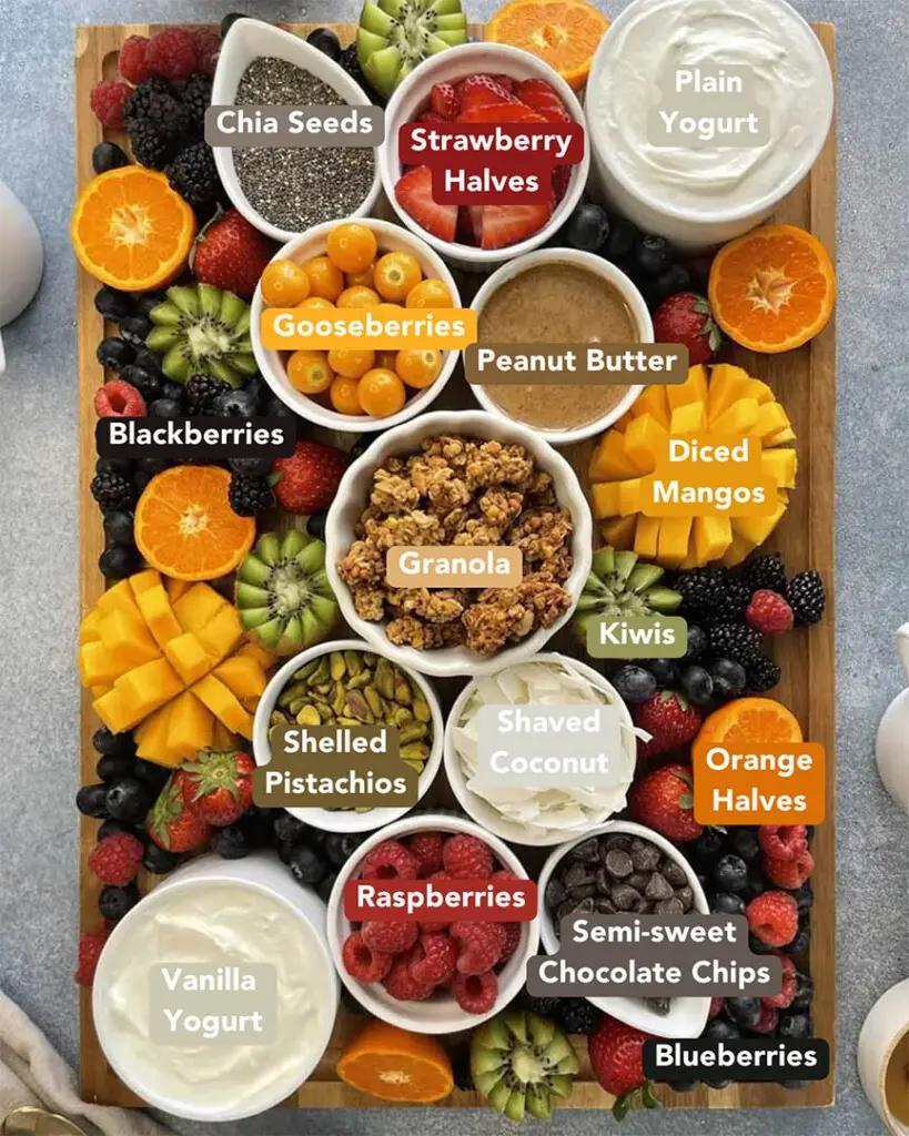 Ingredients laid out on a countertop, including fruits, yogurt, and tara gum powder
