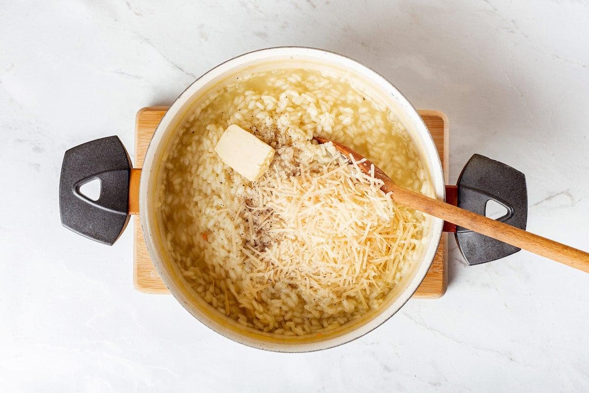 close-up shot of creamy risotto being stirred in a pot