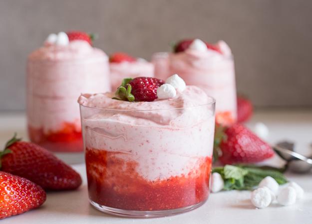 Ingredients for strawberry mousse on a kitchen counter