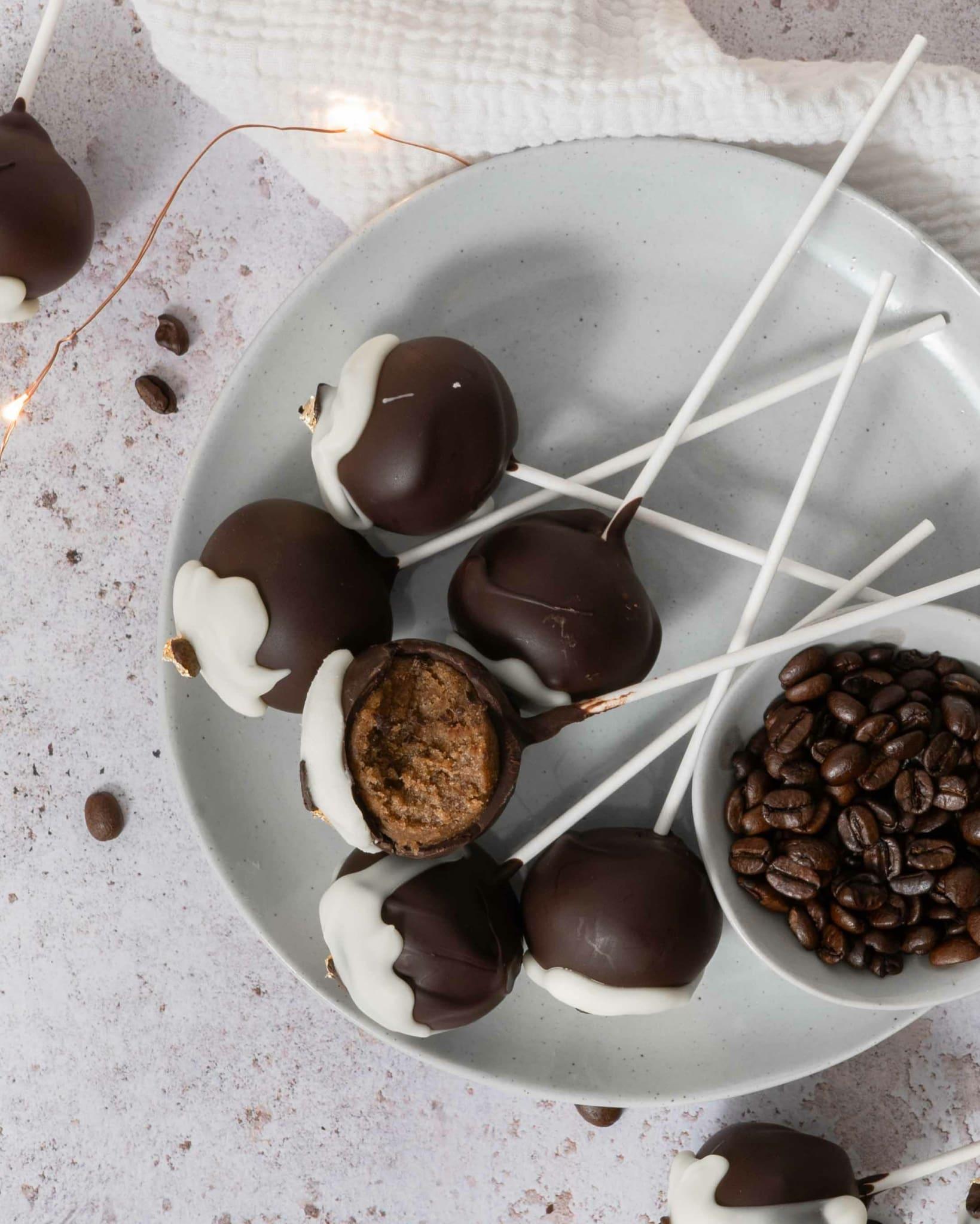 tiramisu pops being dipped in chocolate