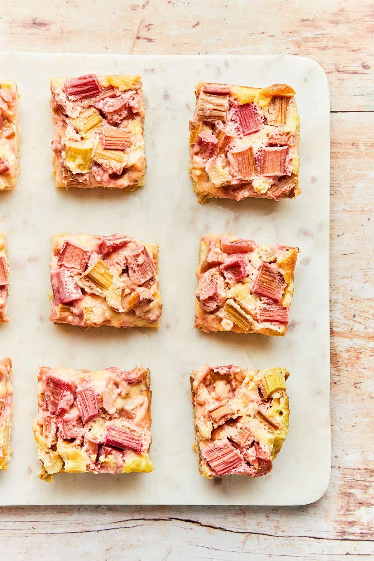 freshly baked rhubarb custard bar being cut into squares