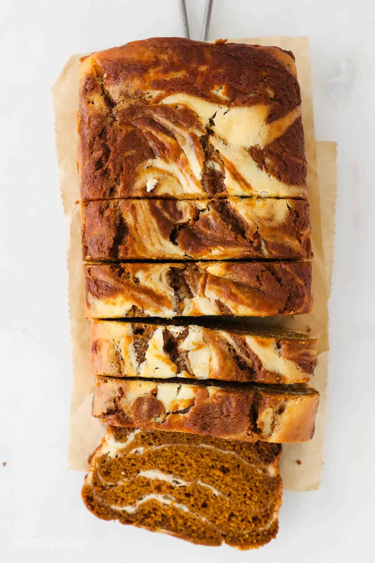 overhead shot of pumpkin cream cheese bread pudding swirl in a baking dish
