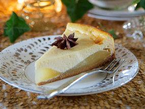 Spiced pear and ginger cheesecake swirl on a rustic wooden table