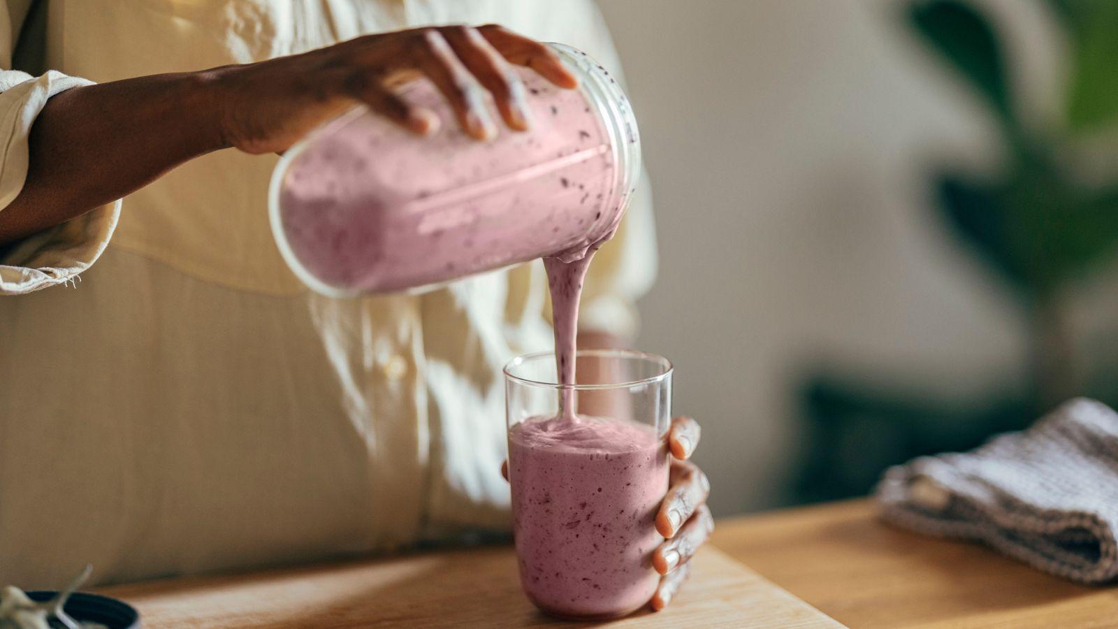 Close-up shot of a blender creating a milkshake