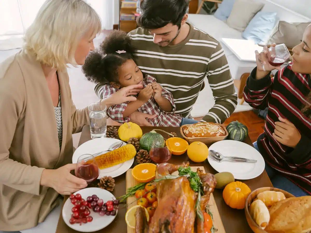 Warm, inviting scene of people gathered around a table, sharing slices of homemade pumpkin pie, laughing and talking