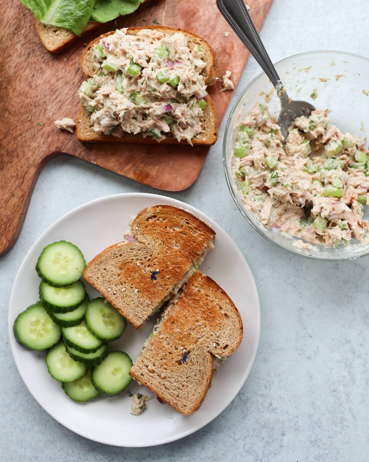 Overhead shot of a finished Mediterranean tuna salad sandwich, cut in half