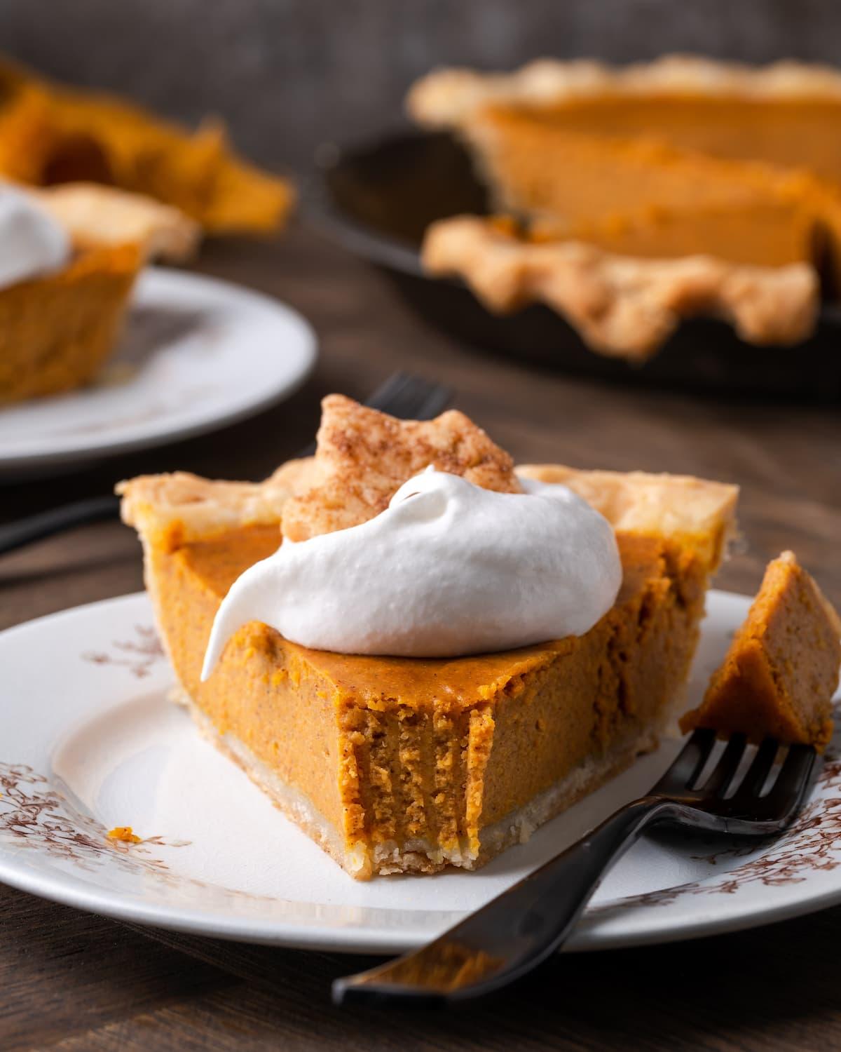 smooth and creamy pumpkin pie filling being poured into an unbaked pie crust