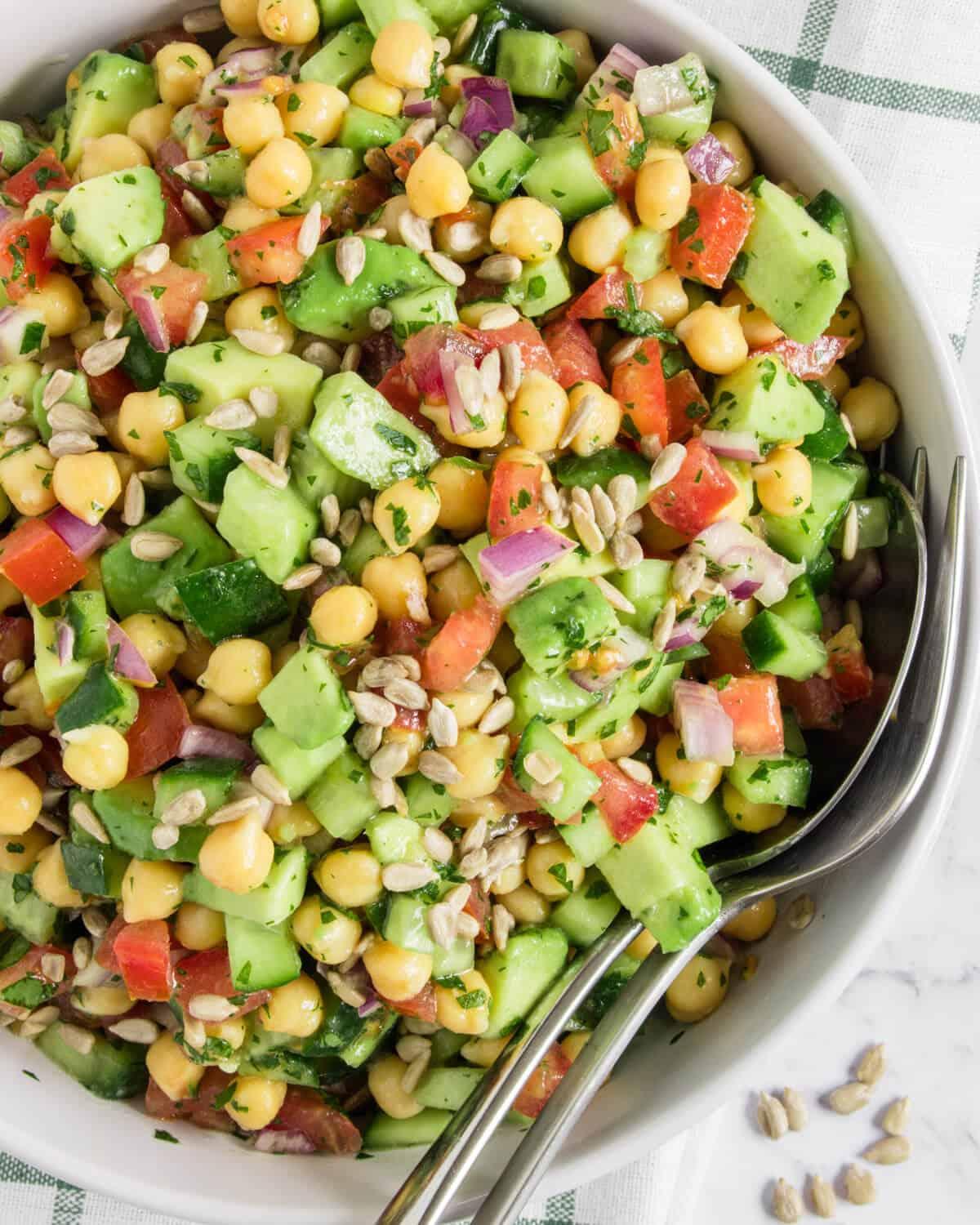 Avocado chickpea salad in a bento box, vibrant and colorful