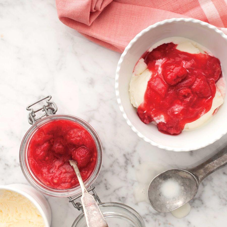 Espresso Martini Rhubarb Compote being spooned over a bowl of yogurt