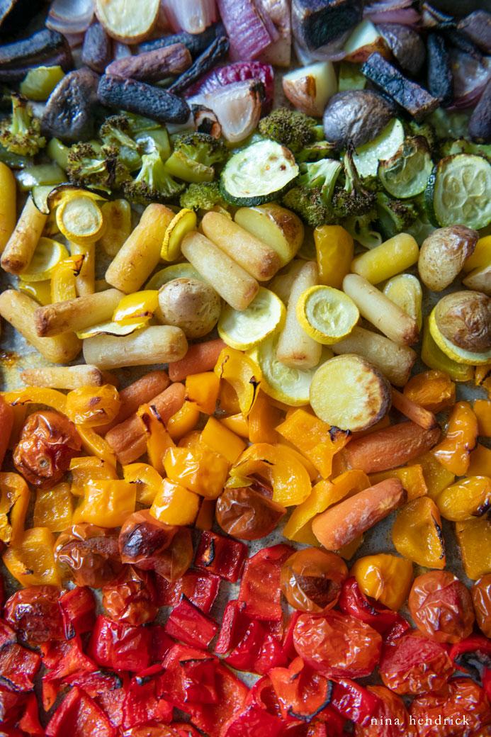 various roasted vegetables like bell peppers, zucchini, and corn arranged in a colorful display
