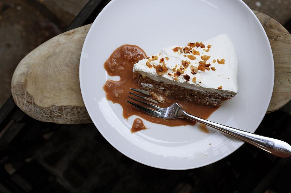 slices of cake on plates with forks, ready to be eaten