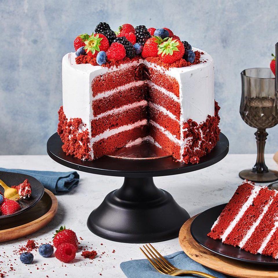 close-up of candied fruits decorating a red velvet cake