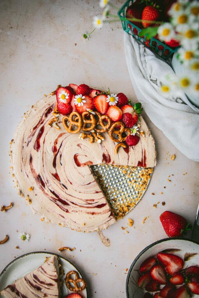 Overhead shot of Strawberry Cashew Cake with a slice cut out