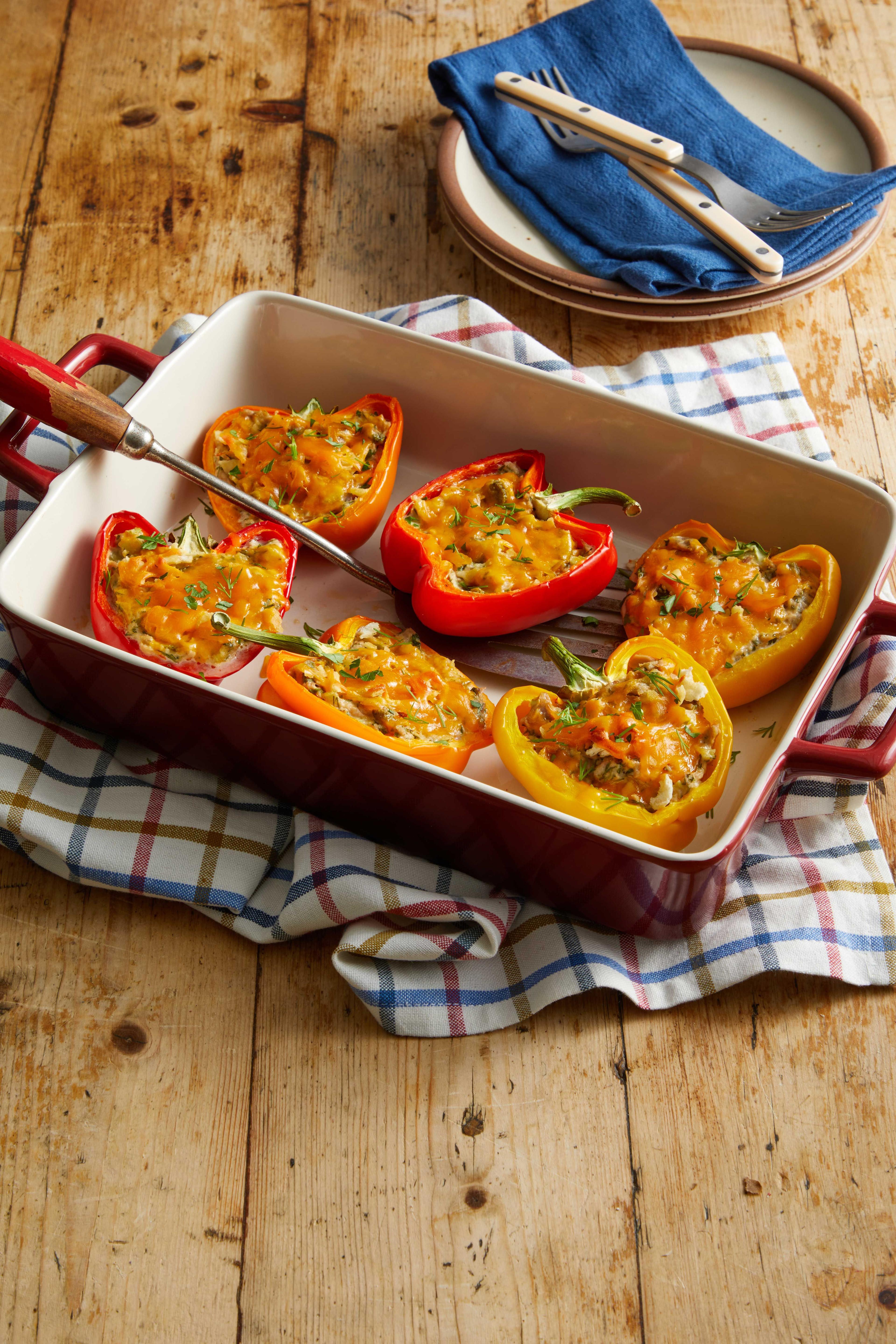 Stuffed bell peppers arranged on a patriotic-themed serving dish, garnished with parsley.