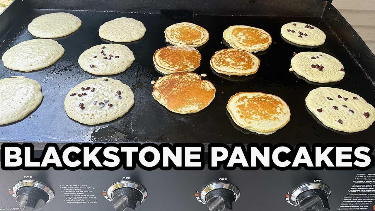 pancakes being flipped on a griddle