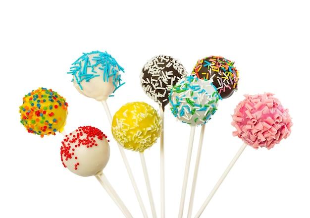 close up shot of mimosa cake pops on a bright white background