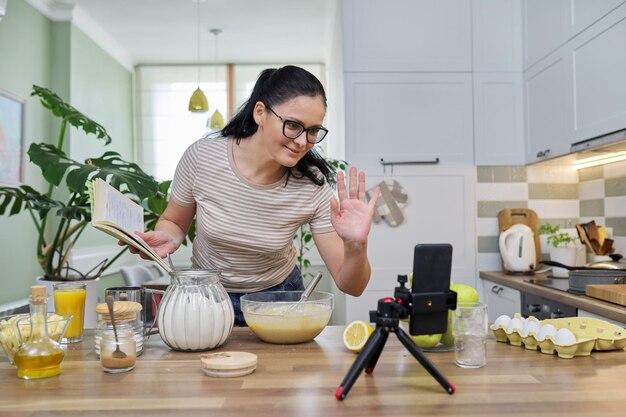 woman preparing apple sage sparkle shake in kitchen