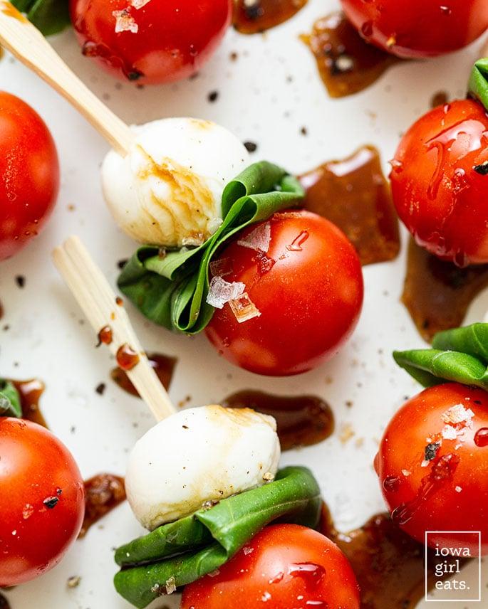 close up of caprese skewers drizzled with balsamic glaze