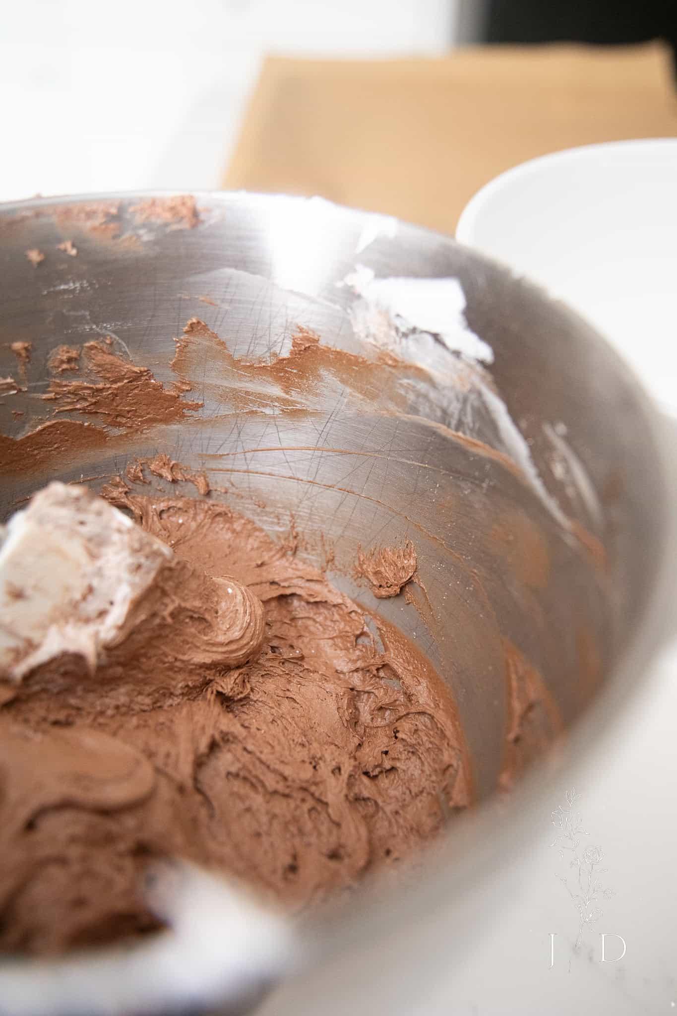 Close-up of cookie cake batter being mixed in a bowl