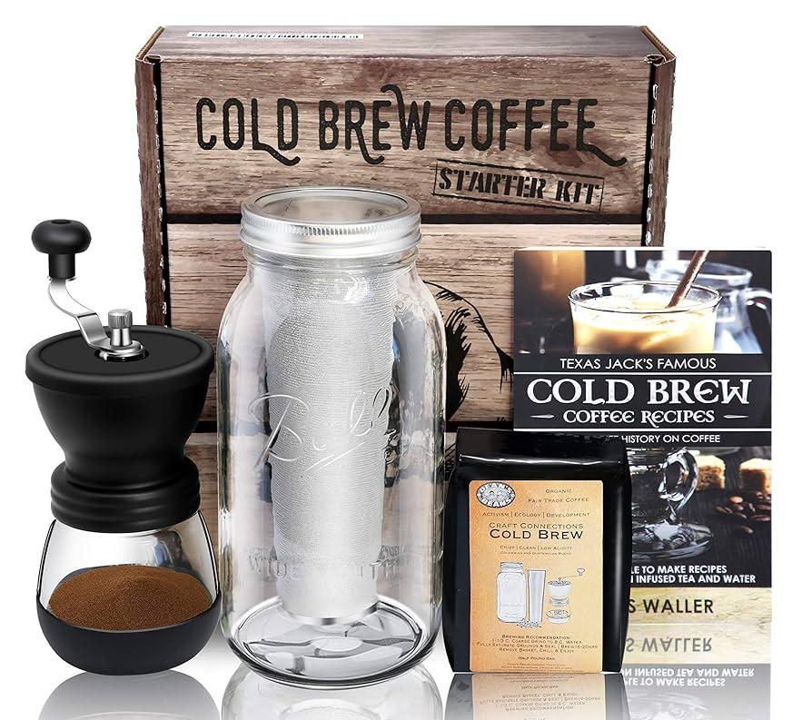 ingredients for probiotic cold brew laid out on a wooden countertop: coffee grounds, water, probiotic capsules, mason jars