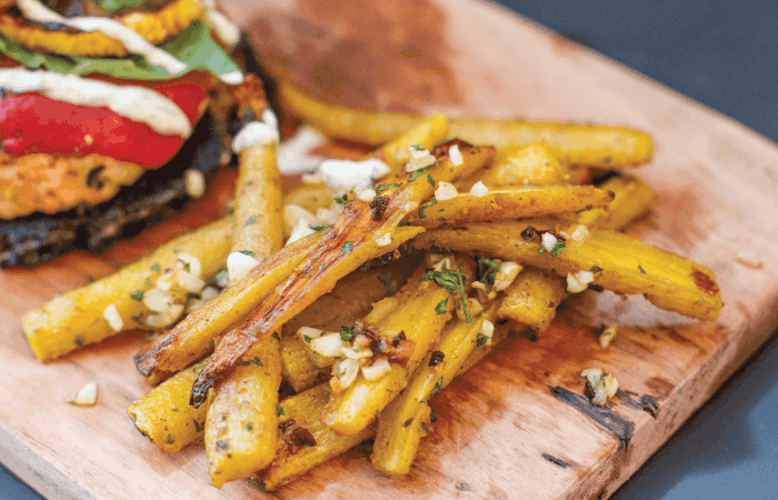 Close-up of Blackberry Sage Carrot Fries, sprinkled with sea salt