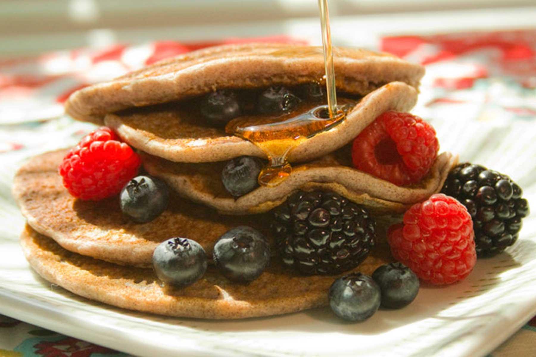 ingredients for gluten-free sorghum pancakes on a wooden countertop