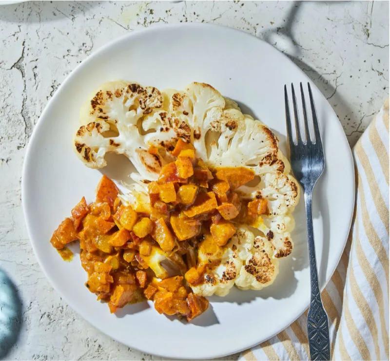 cauliflower steaks topped with maasdam cheese and pears