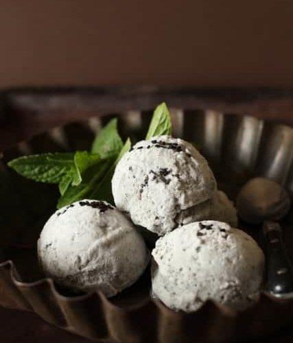 swirls of black sesame and lavender frozen yogurt in a glass bowl