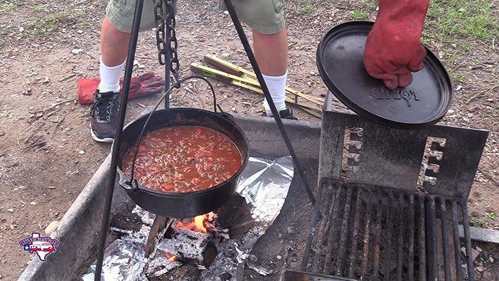 close up shot of cooking chili in a dutch oven