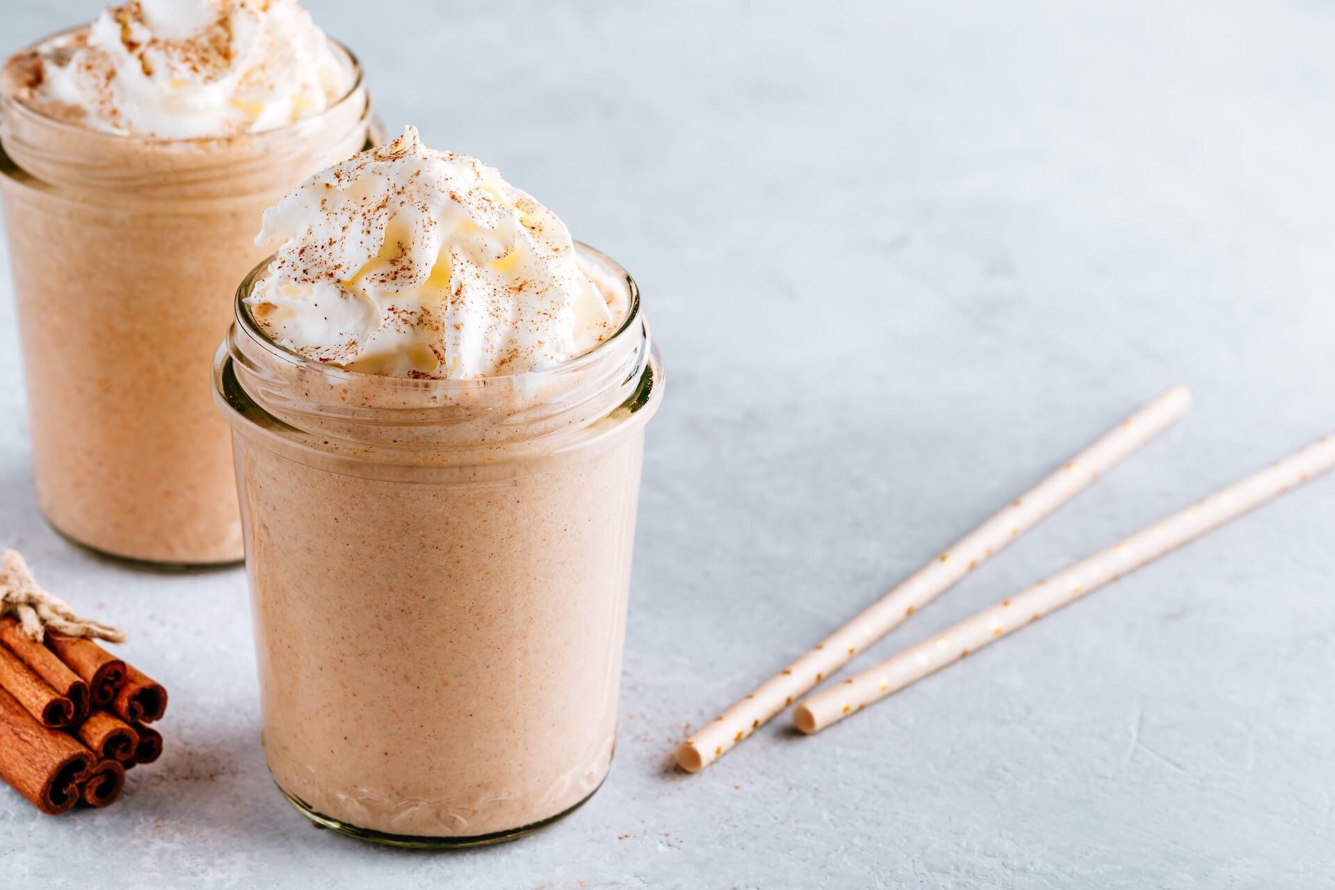 spiced apple pie milkshake with whipped cream and cinnamon