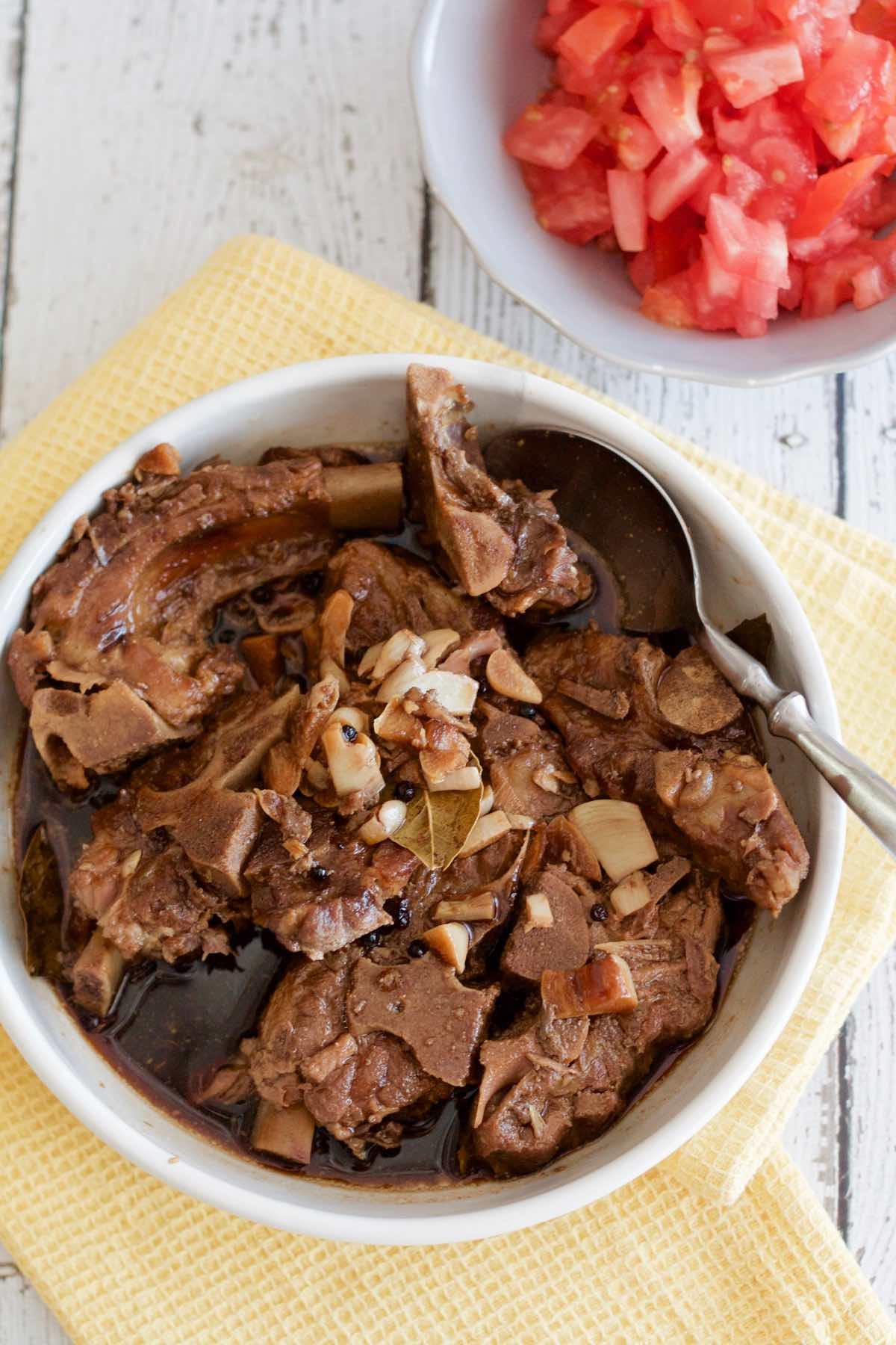 adobo ribs simmering in a pot