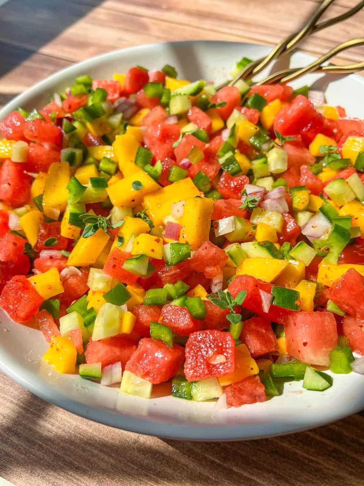 close-up shot of the texture and colors of watermelon mango salsa