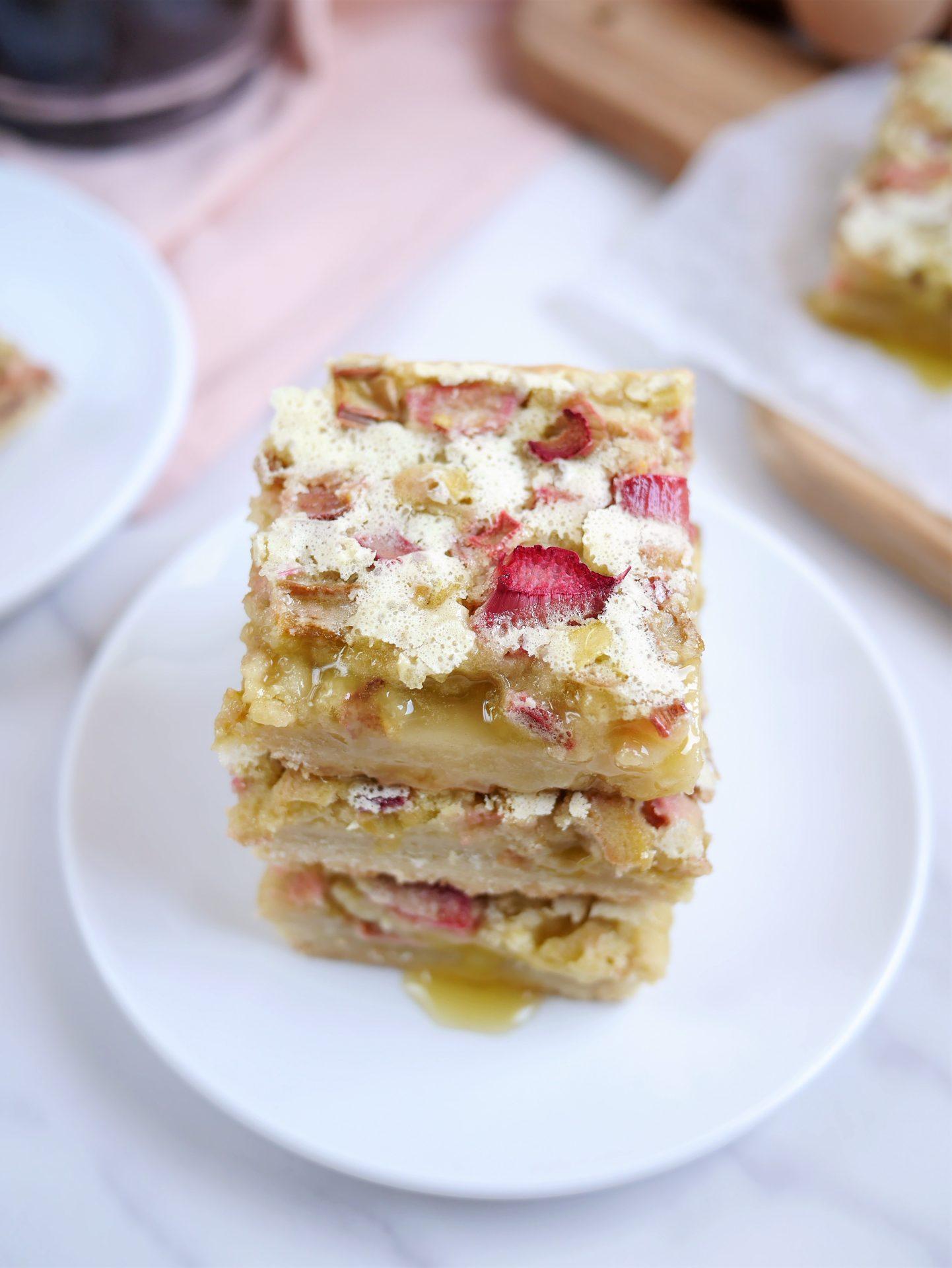elderflower rhubarb custard filling being poured onto a shortbread crust