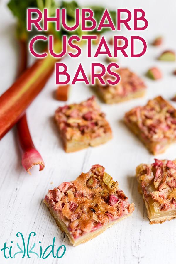 rhubarb custard bars on a rustic wooden surface