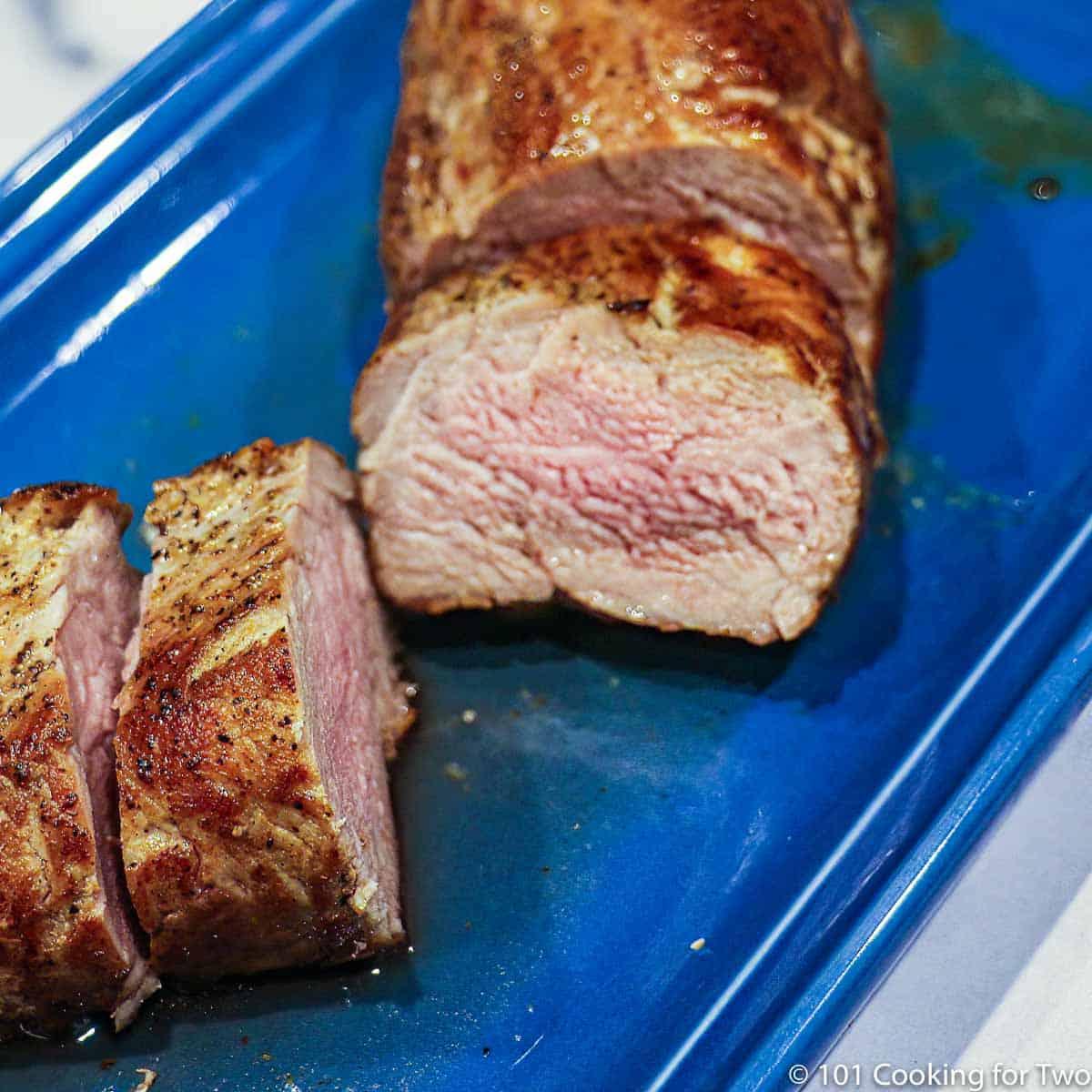 griddle with pork tenderloin searing