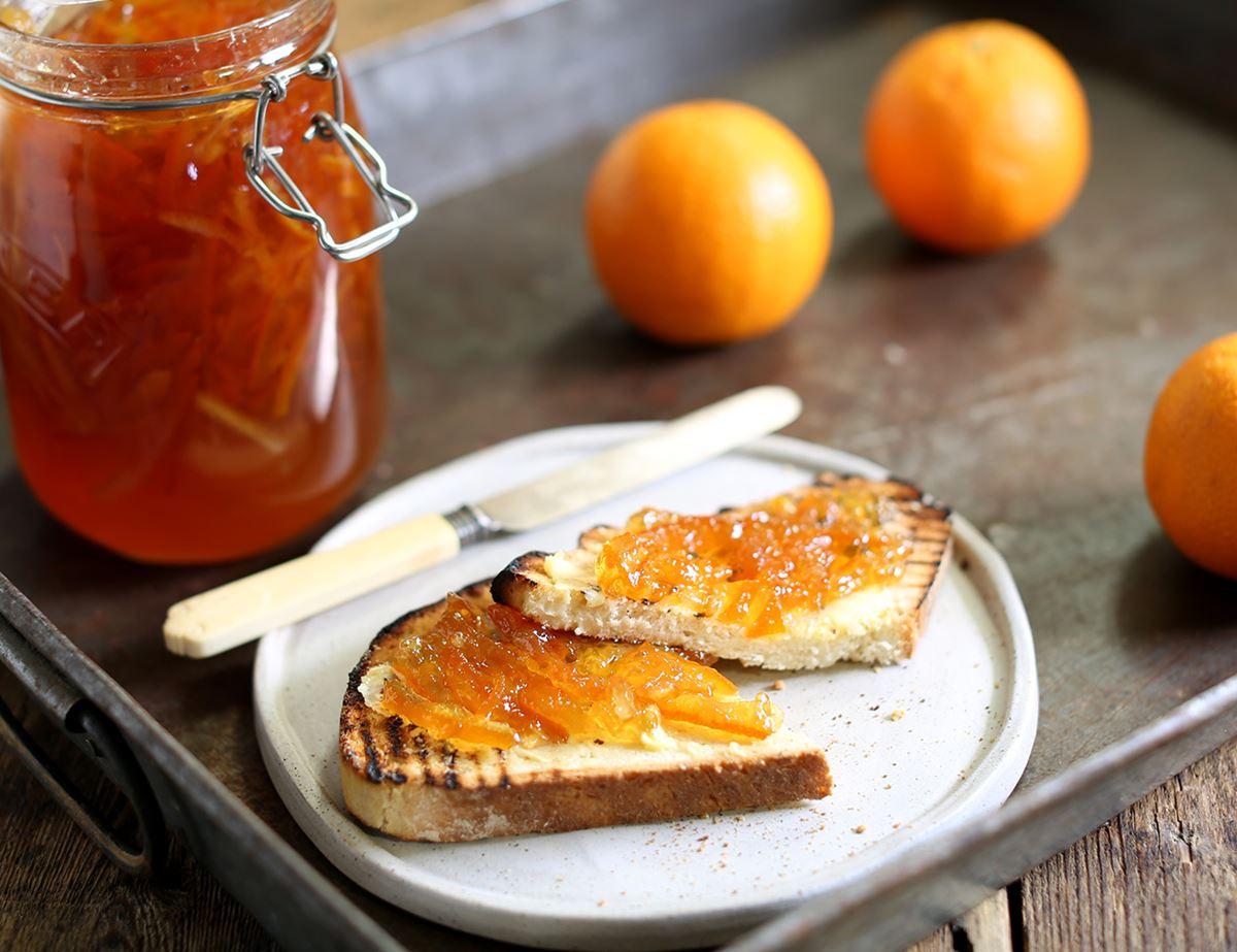 Seville orange marmalade on toast with visible orange peel
