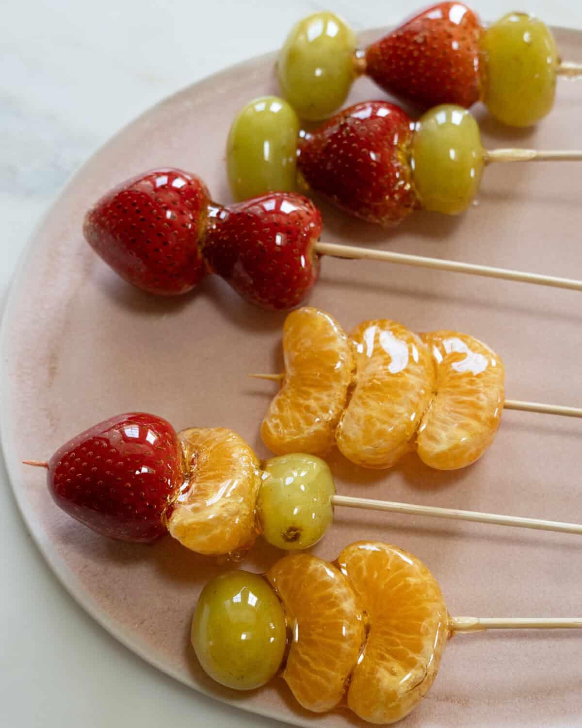 pieces of golden honeycomb next to fresh strawberries