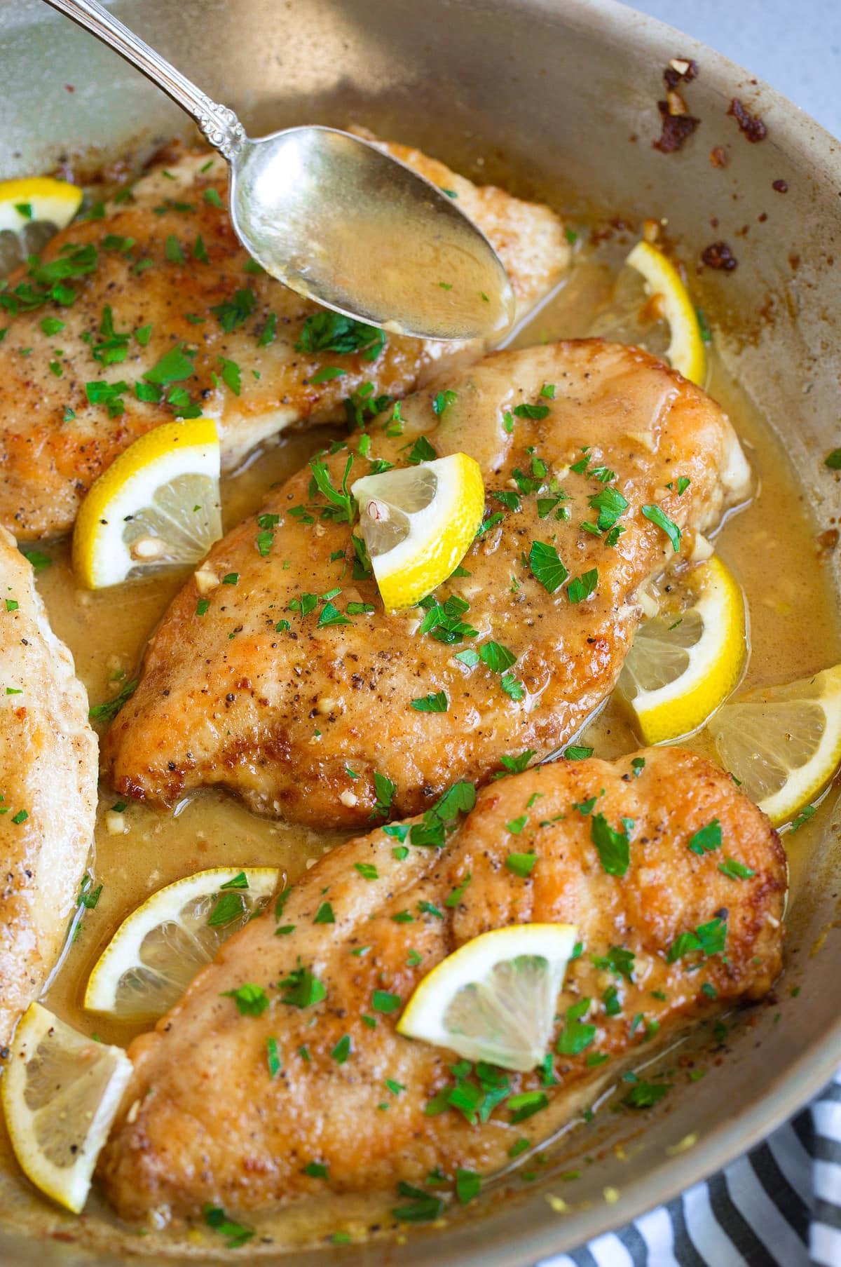 Perfectly seared lemon butter chicken breast with fresh parsley
