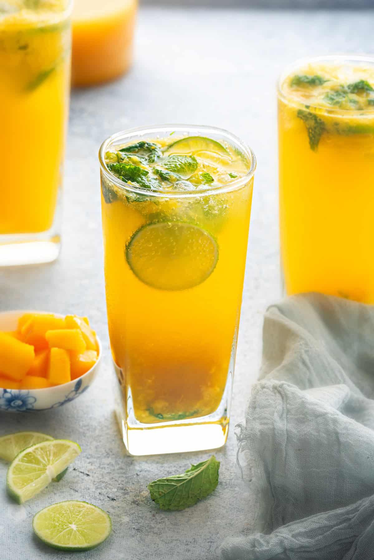 Marjoram Mango Virgin Mojito in a glass with fresh mint and mango slices