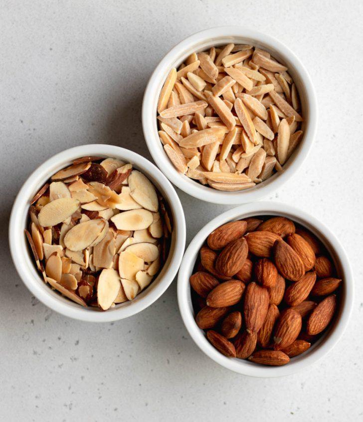 A pile of toasted almond slivers, showing their golden-brown color and texture