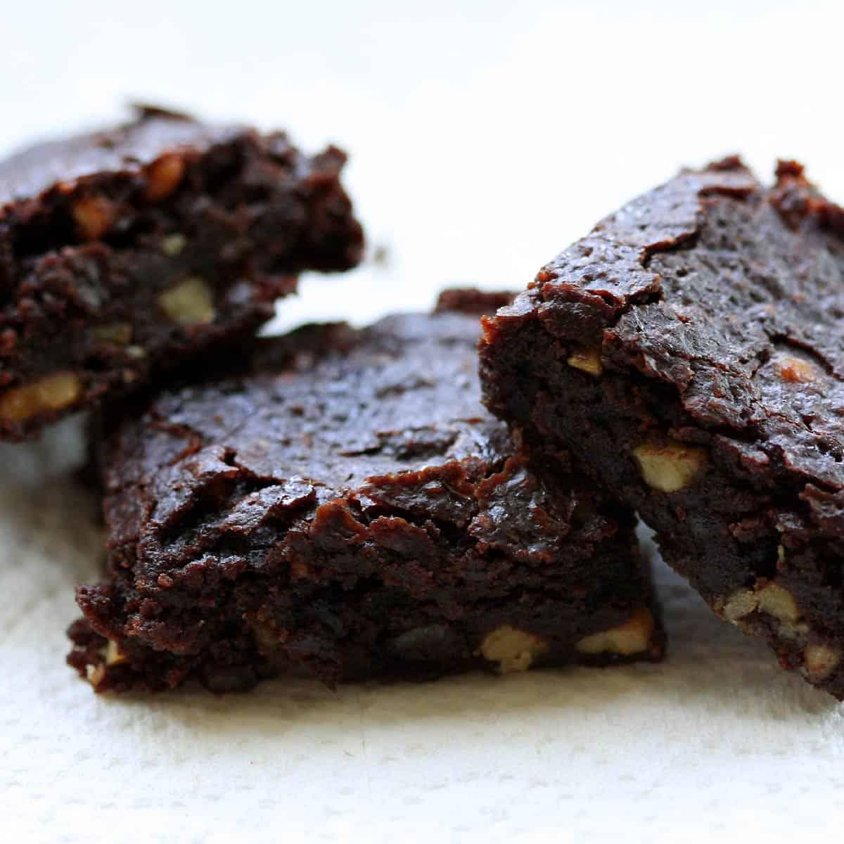 a batch of freshly baked vegan tofu brownies cooling on a wire rack