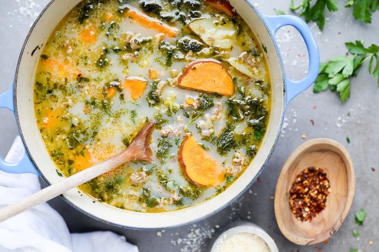 bowl of spicy sausage kale and potato soup