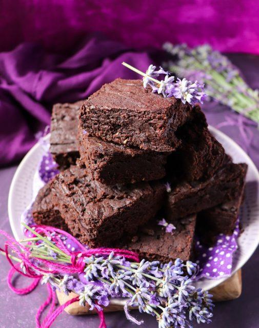 homemade brownies drizzled with lavender honey, with a sprig of lavender