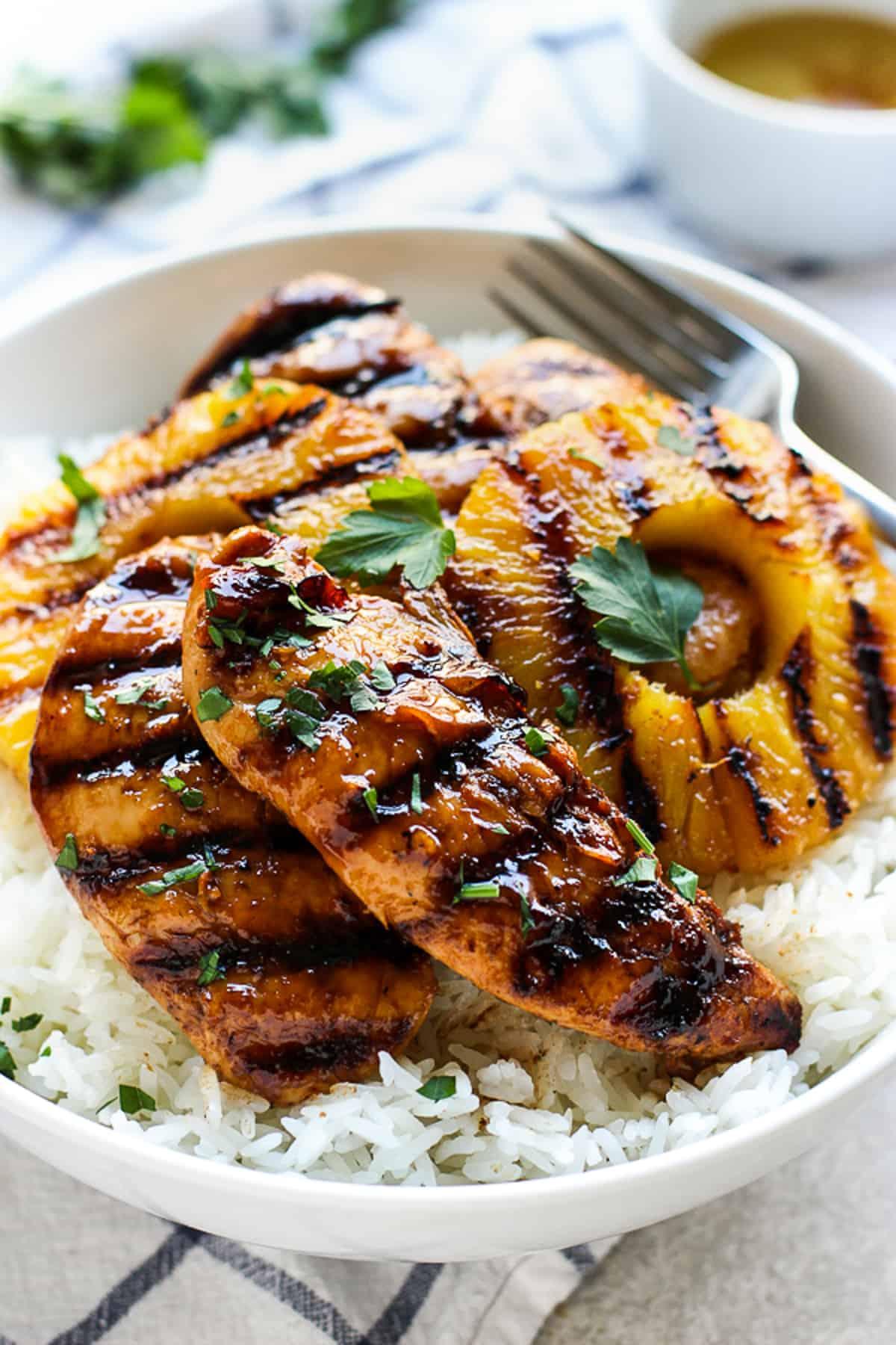 finished grilled pineapple and coconut chicken dish served with rice