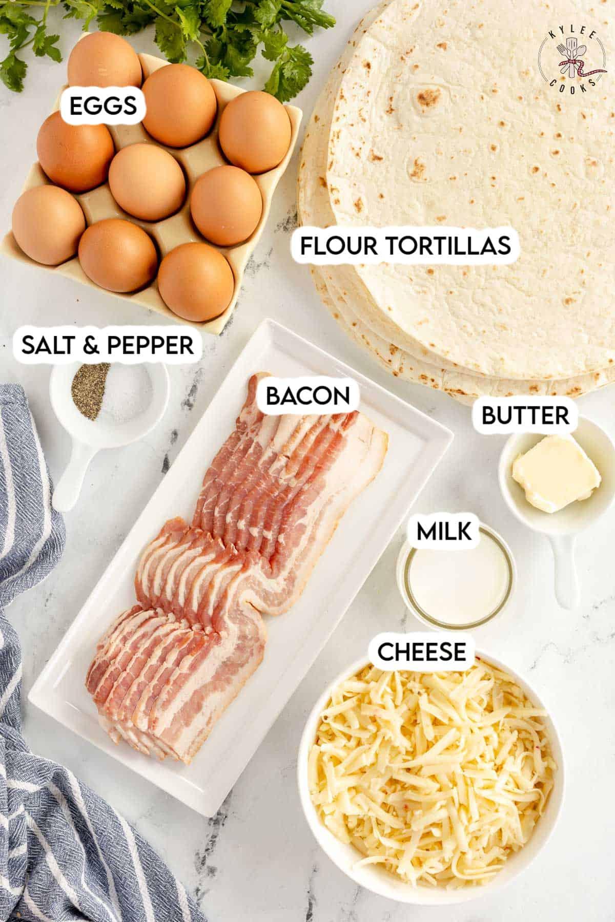 Ingredients for breakfast quesadillas laid out on a wooden table