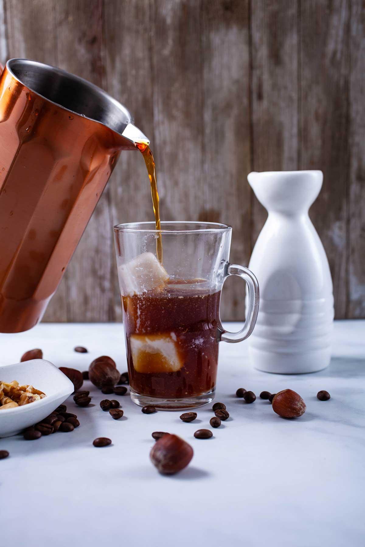a pitcher of cold brew coffee steeping in the refrigerator, natural light