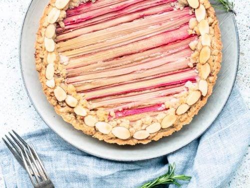 slice of rhubarb and macadamia tart with a fork