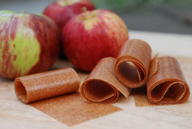 ingredients for apple fruit leather baked apples laid out on a kitchen counter