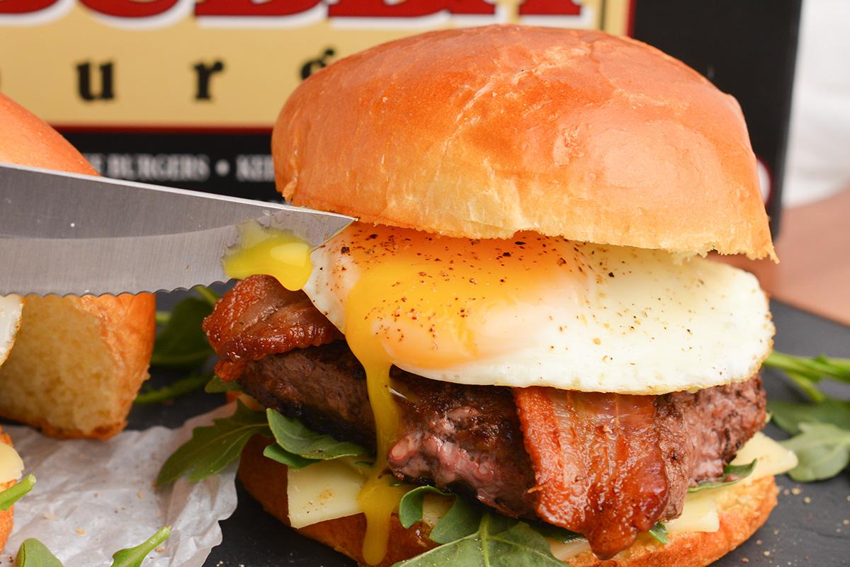 close-up of a breakfast burger being assembled