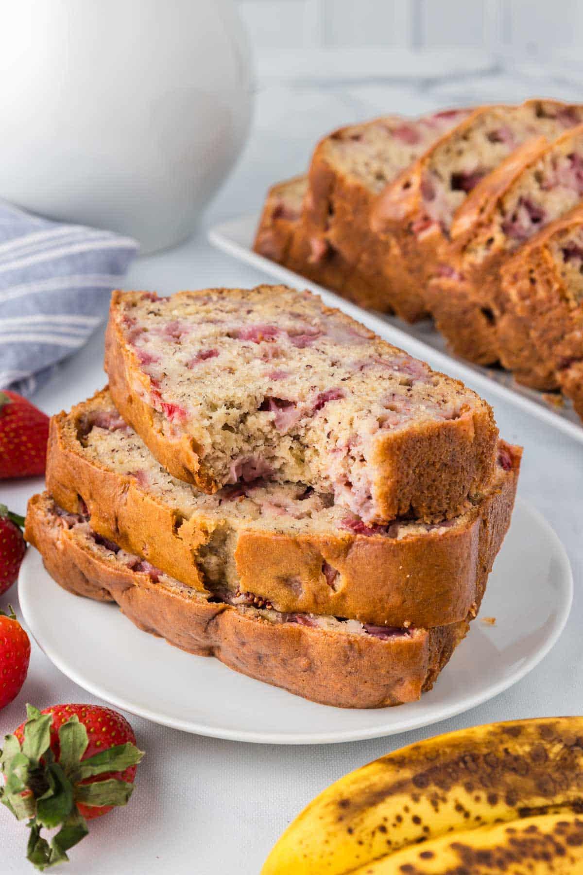 slices of strawberry daiquiri banana bread on a plate